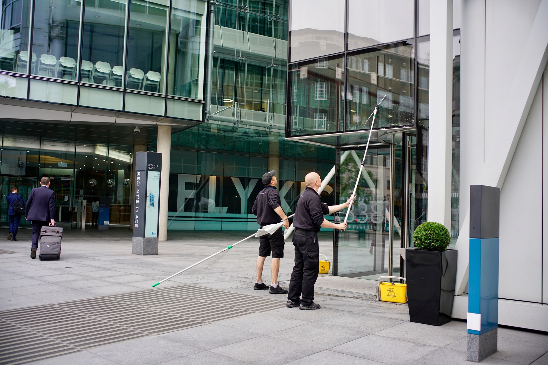 cleaning the glasses of a commercial building